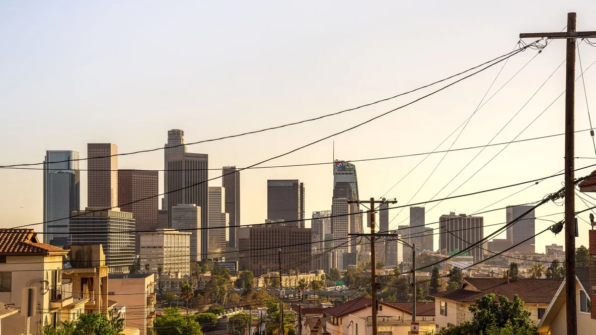 Downtown Los Angeles skyline at golden hour, with the US Bank Tower and Wilshire Grand Center rising above the city