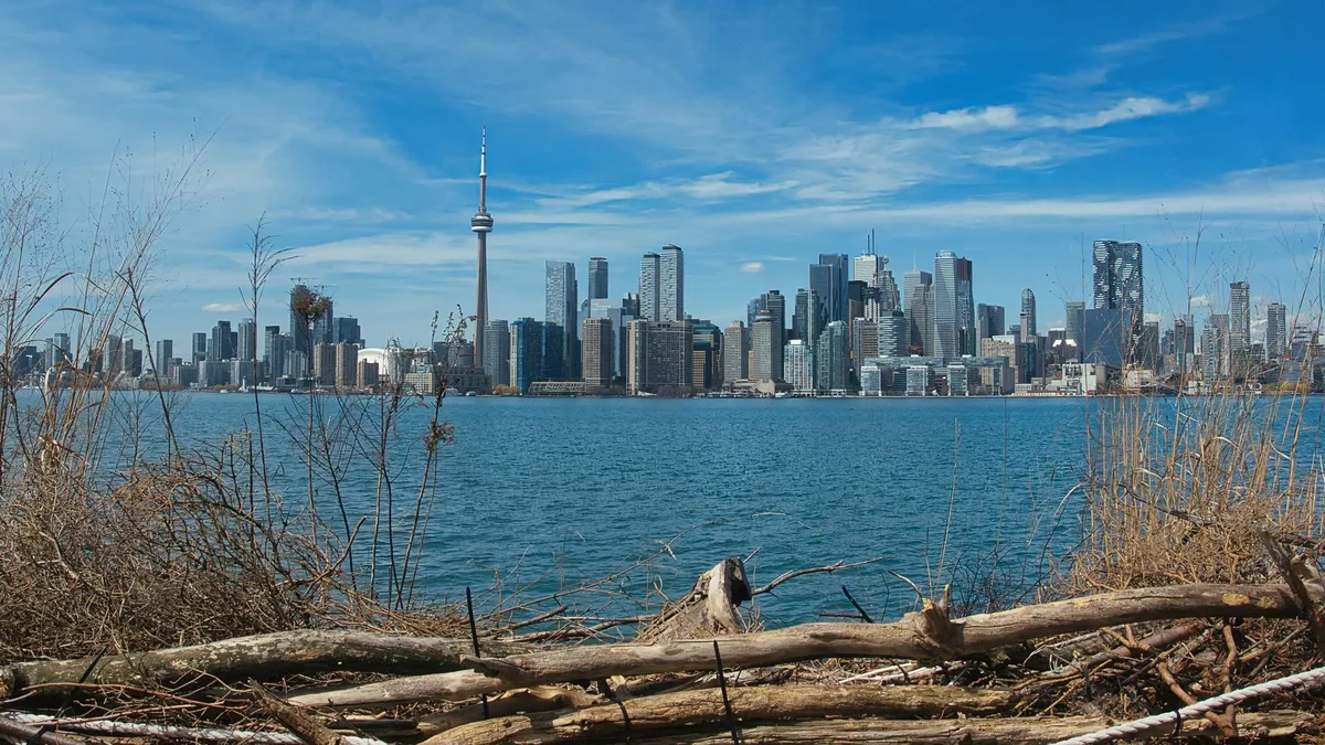 Toronto skyline scene with the CN Tower, representing Canada in a Canada vs UK tax comparison