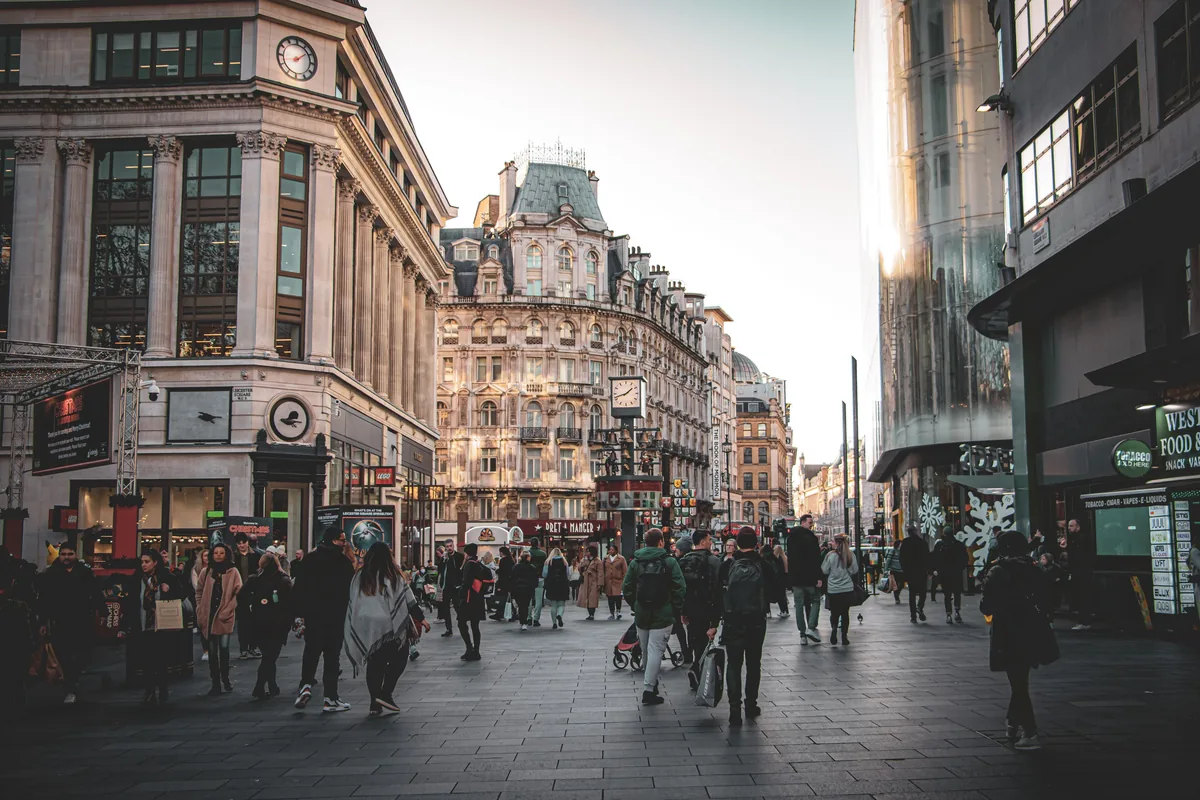 Bustling London street with pedestrians and historic British buildings, illustrating UK income tax on a £50,000 salary